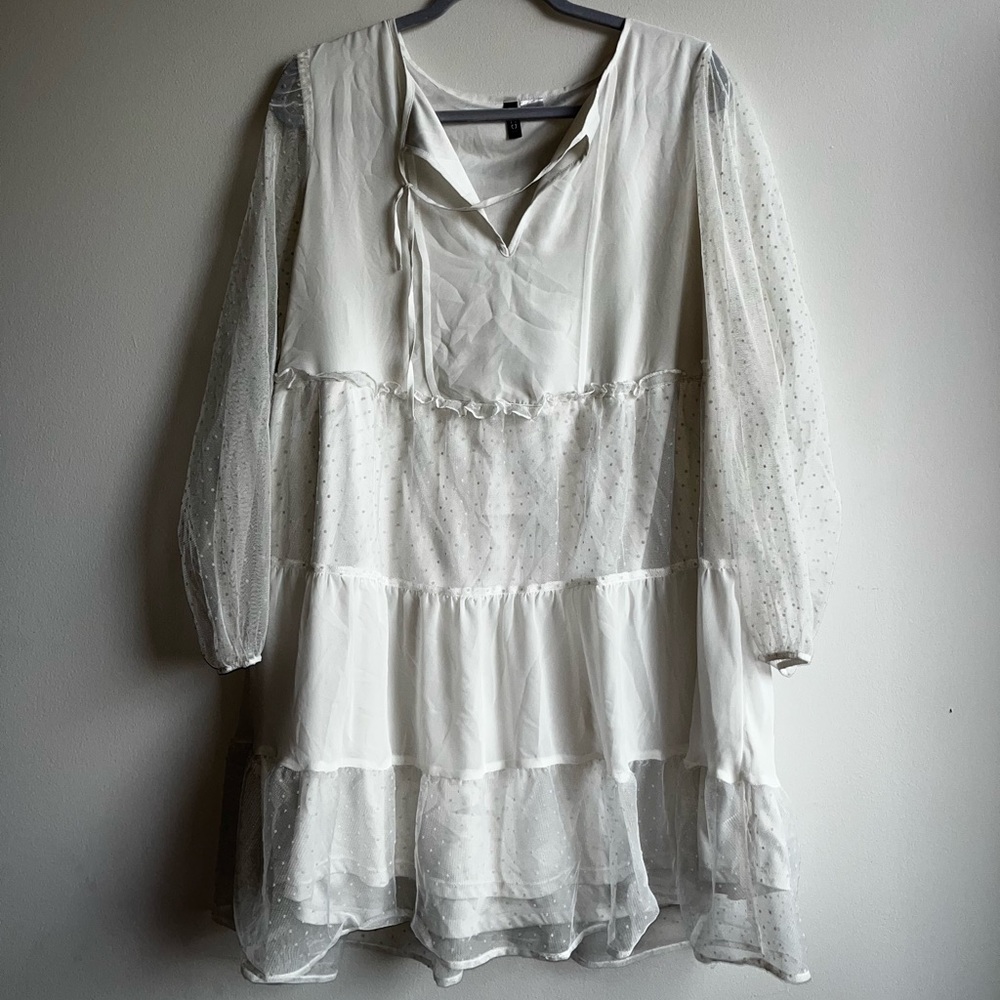 White king sleeve knee length dress with polka dot sheer sleeves